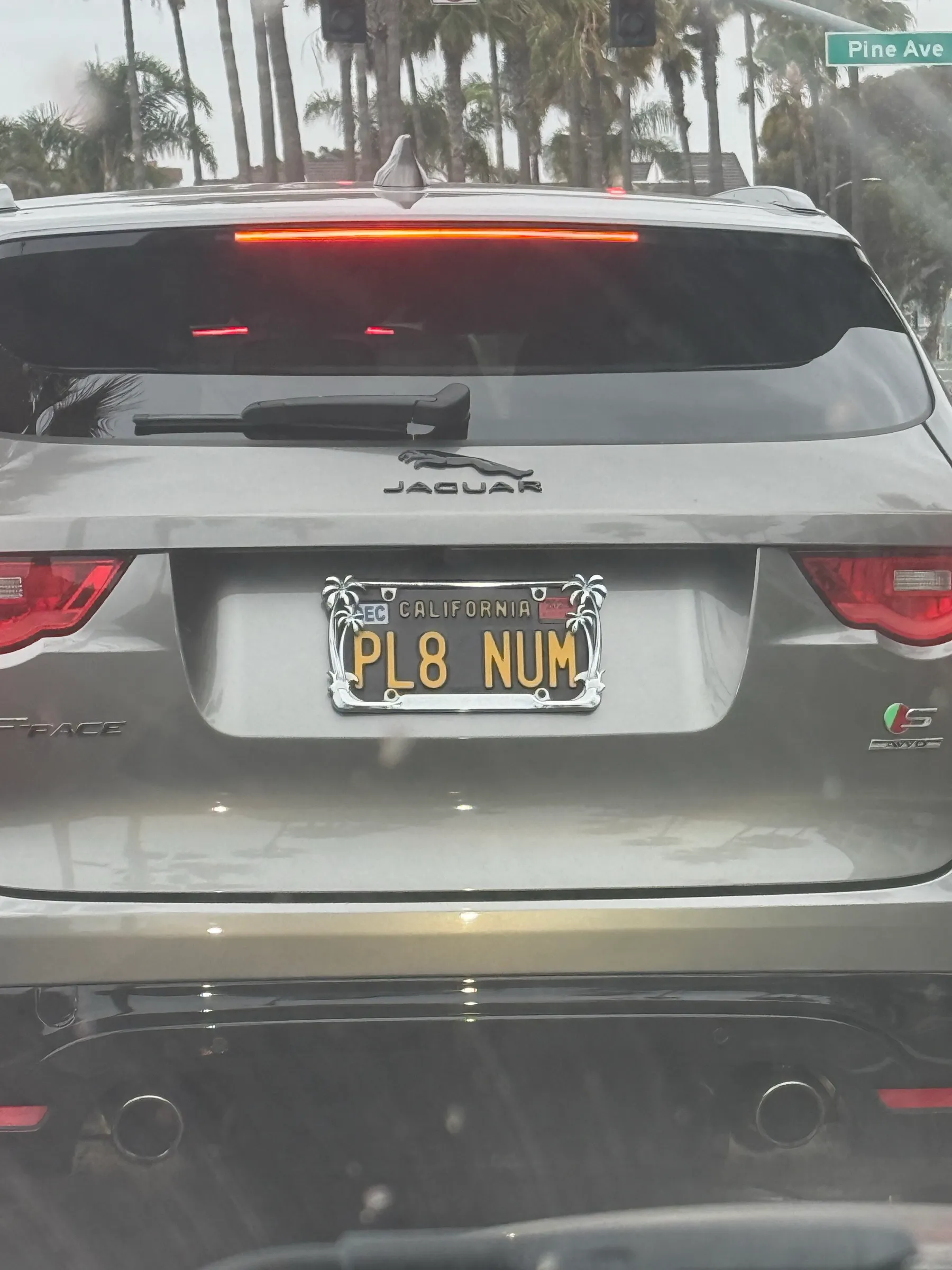 A Jaguar with the California vanity plate PL8 NUM