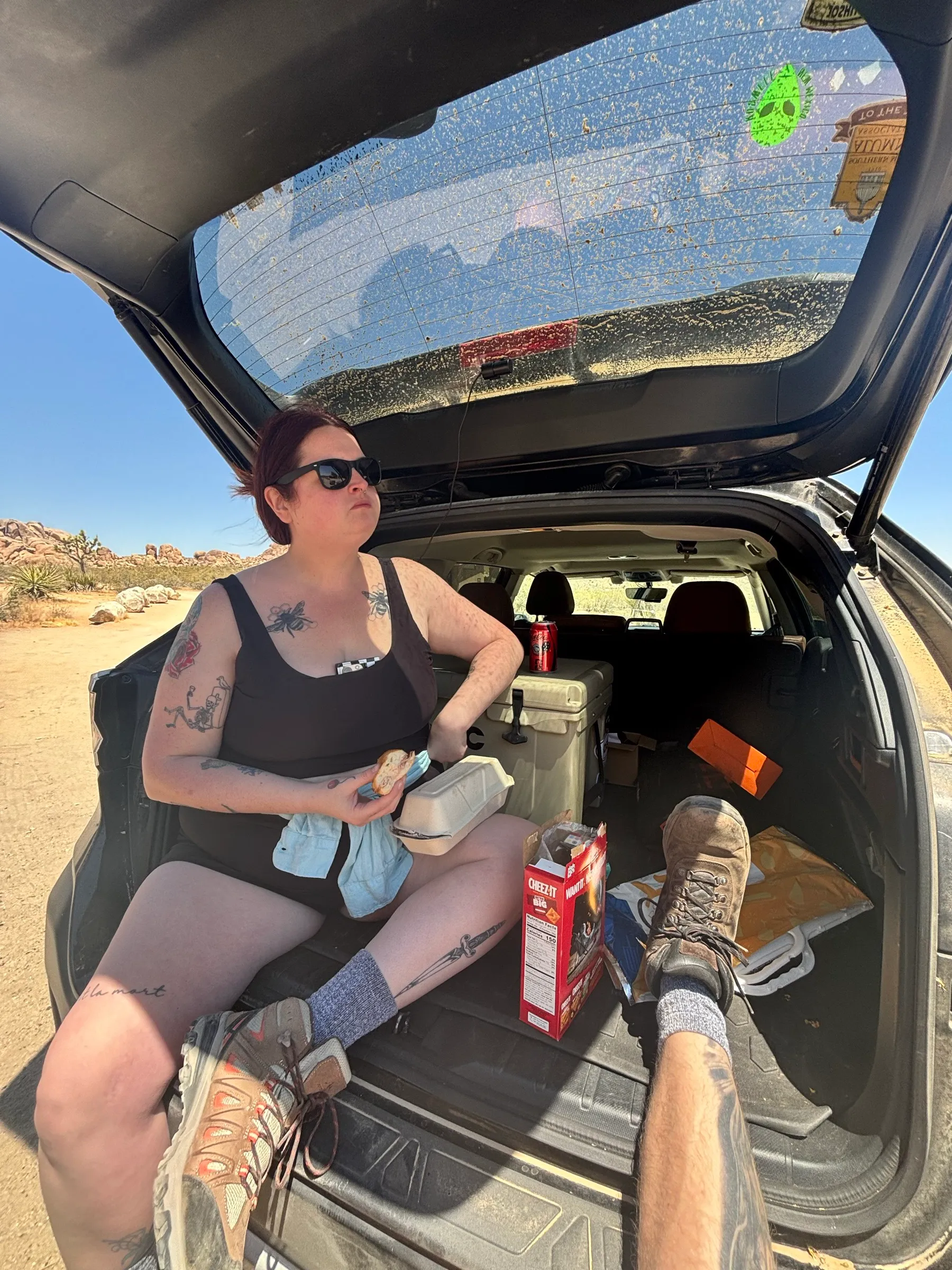Eating lunch out of the trunk of the car, Cheez-Its within reach