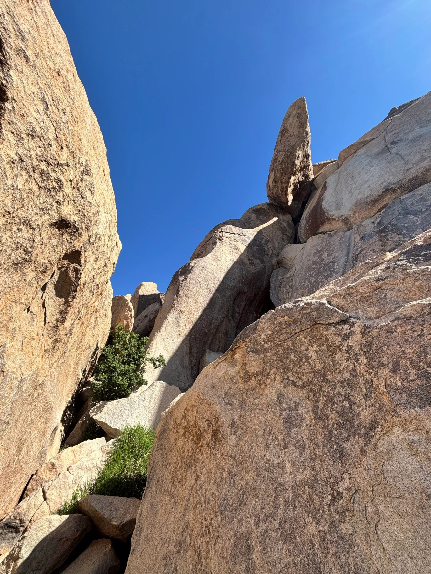 Looking up at stacked granite boulders
