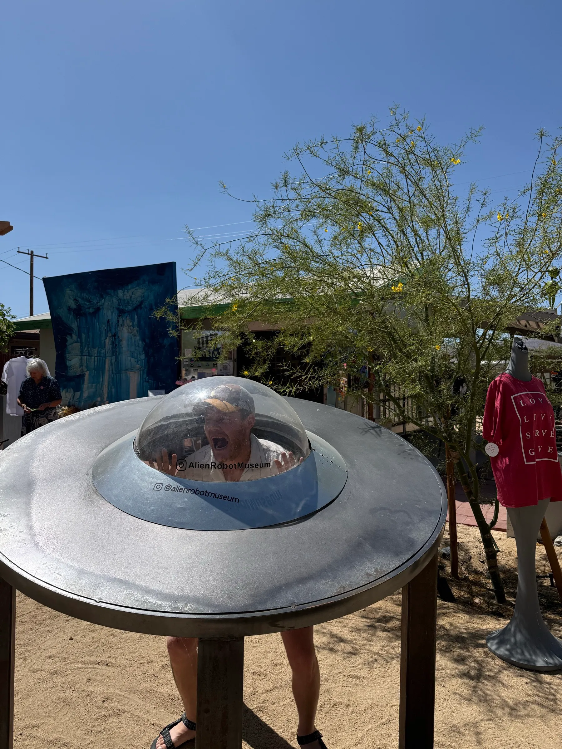 Screaming inside the dome of a UFO photo op at the Alien Robot Museum